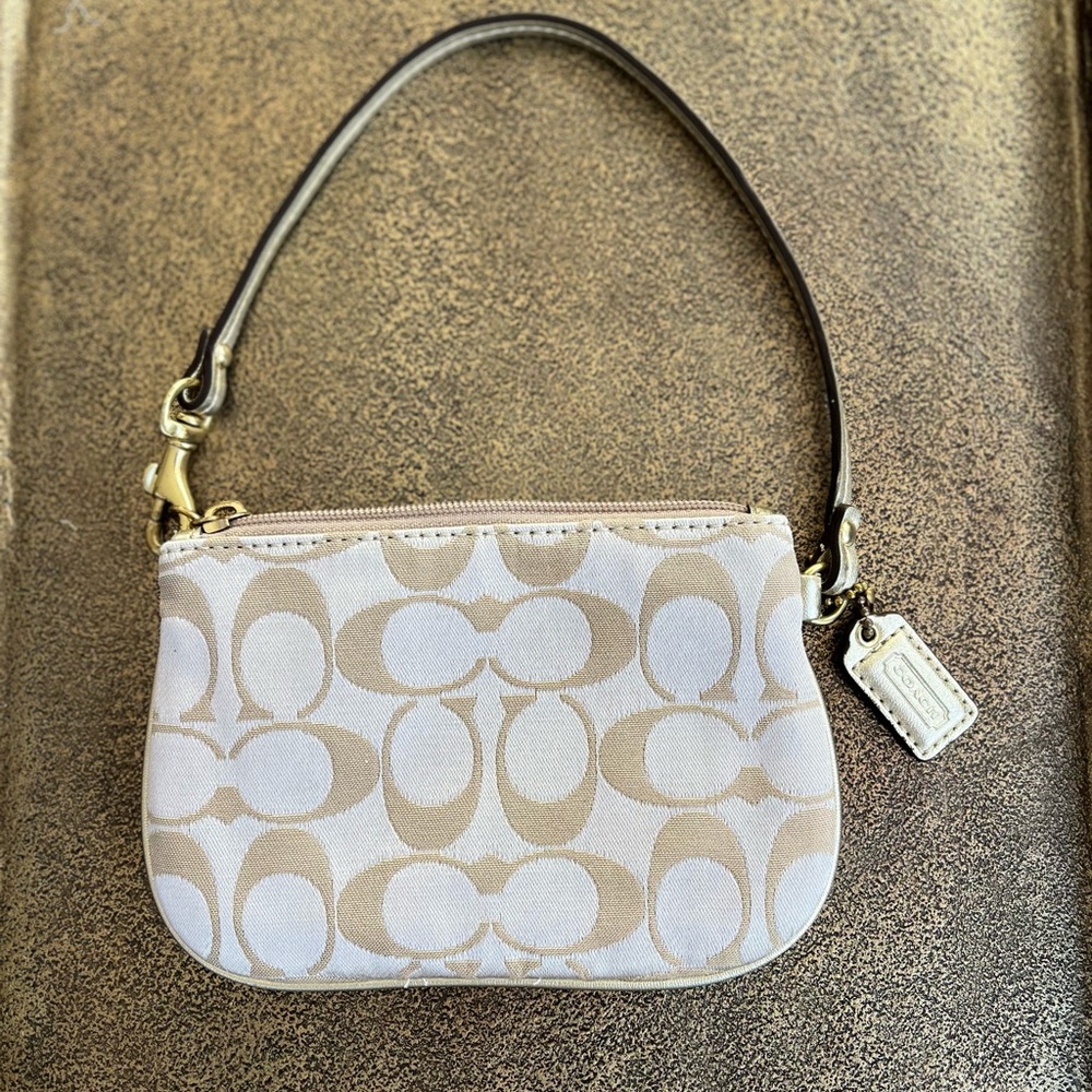 COACH genuine signature fabric and leather trim wristlet cosmetic bag. Gold
